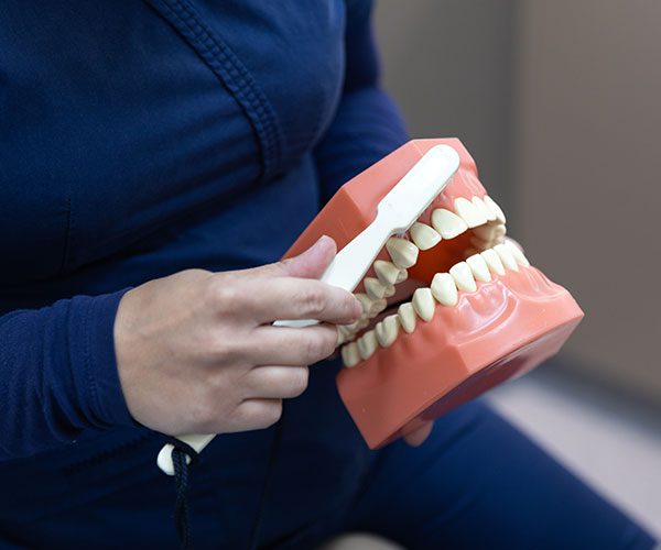 Hygienist performing a dental clean and scale at The Smile Place