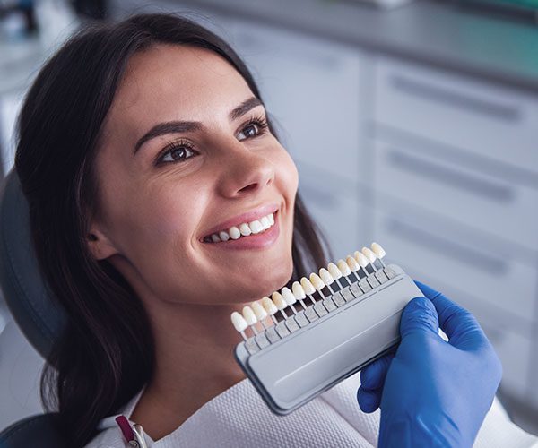 Close-up of porcelain veneers fitted on upper front teeth